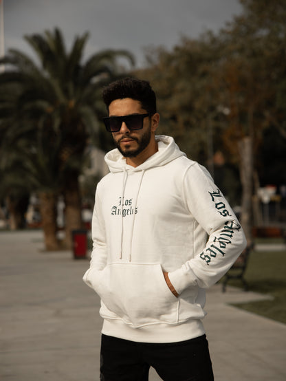 Sudadera con capucha 100% algodón, corte regular fit, diseño Los Angeles, estilo casual y cómodo, perfecta para el día a día. Color blanco.